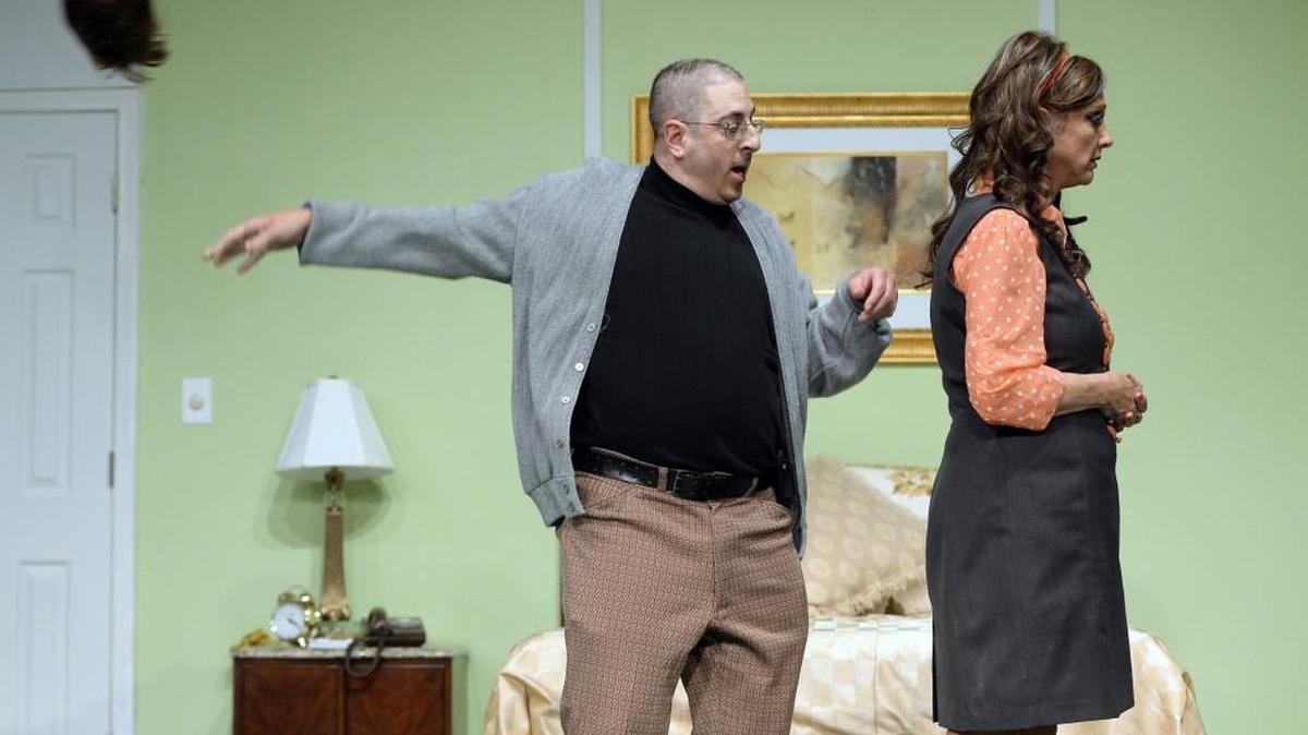 Cody Salisas, as Jesse Kiplinge,r flips his wig over Lee-Anne Fallon, as Muriel Tate, in the Perry Players’ production of “Plaza Suite.”