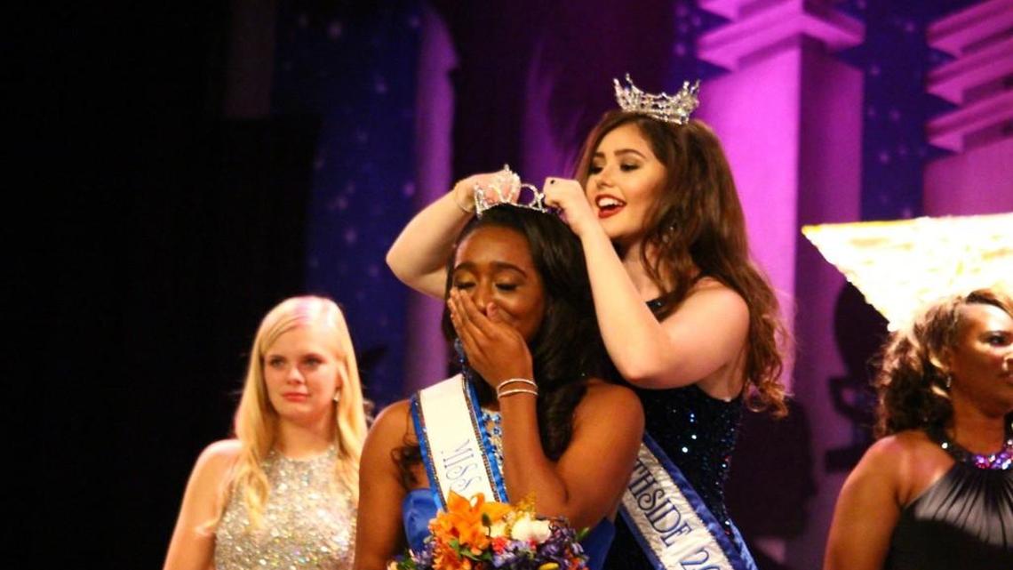 Nayah Terry, Miss Northside High School 2016, is crowned by outgoing Miss Northside 2015, Melanie Wood.