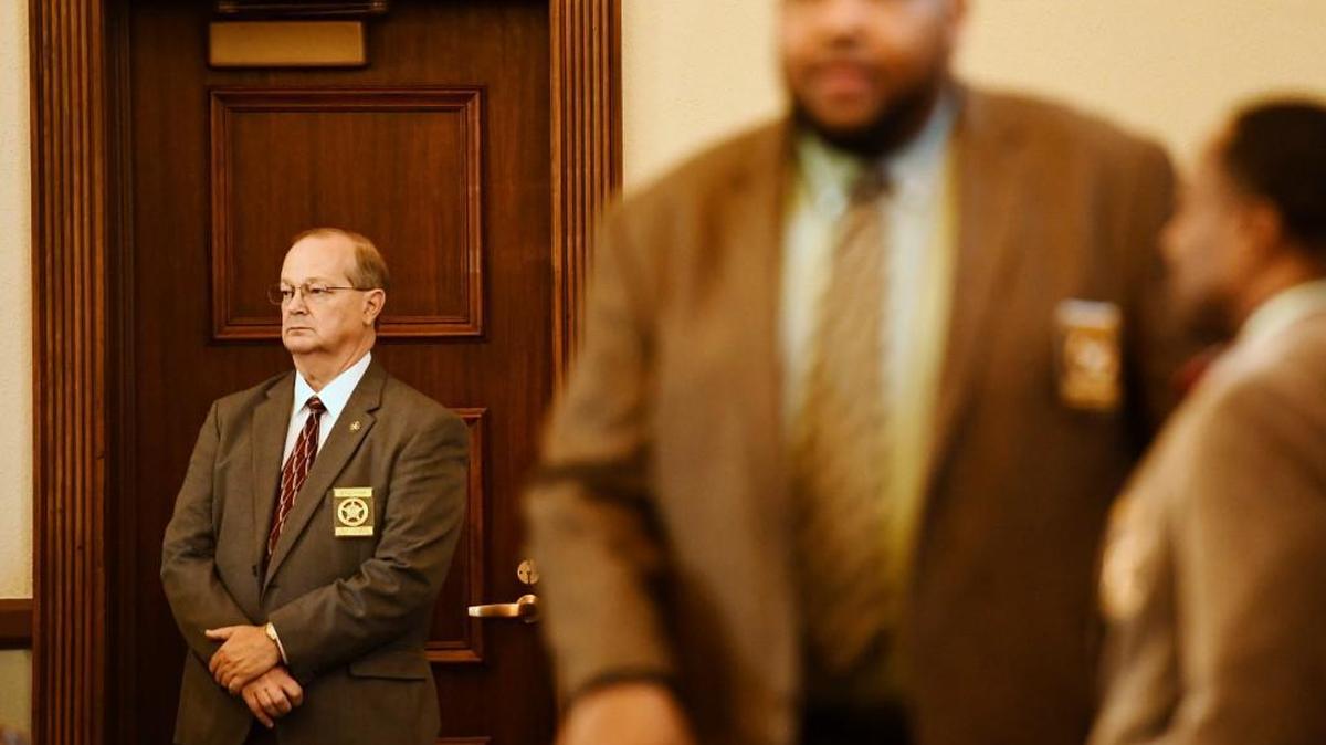 Peach County Sheriff Terry Deese waits at the door for defendant Ralph Stanley Elrod Jr. to arrive at the Peach County Courthouse courtroom in this Telegraph file photo.