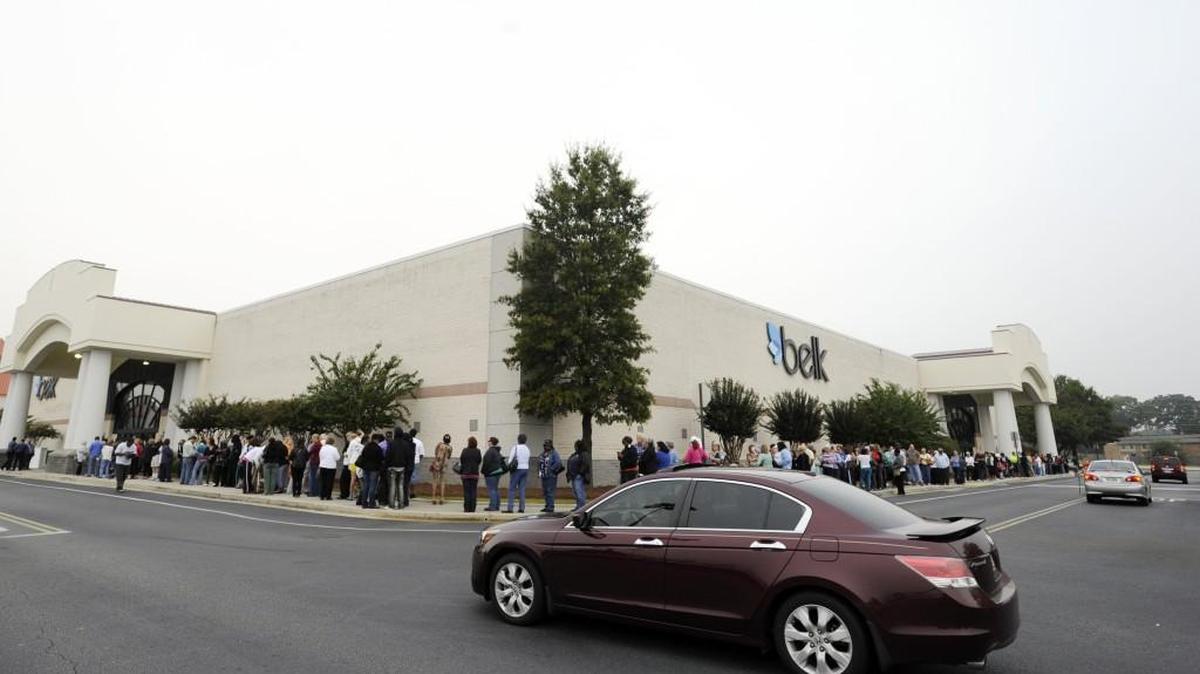 Eager customers lineup around the Belk department store at the Galleria Mall in Centerville in 2012 prior to a Grand Reopening event. Several new lines of merchandise are available at the store along with an additional 20,000 square feet of retail space.