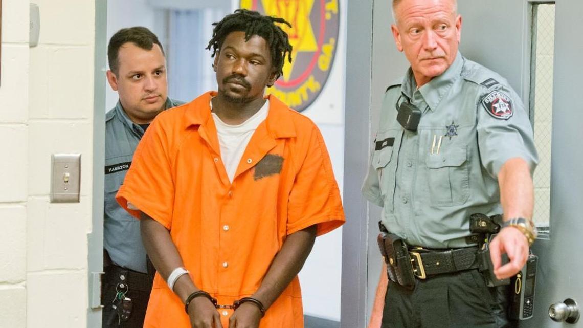 David Brown is led into a Bibb County jail courtroom Aug. 6, 2016. Brown is accused of stabbing 30-year-old Famous Bryant.