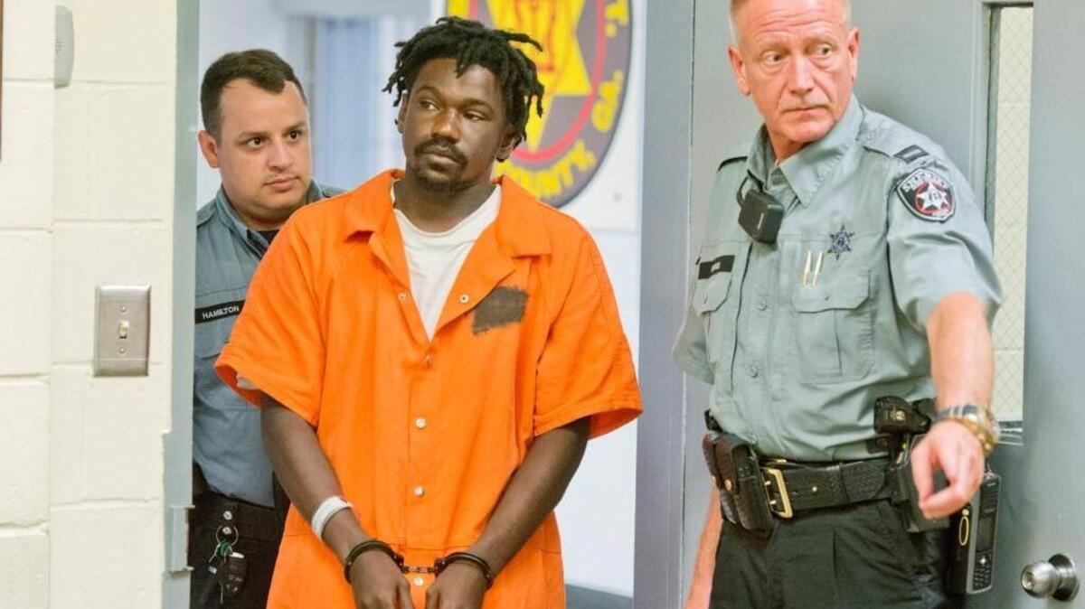 David Brown is led into a Bibb County jail courtroom Aug. 6, 2016. Brown is accused of stabbing 30-year-old Famous Bryant.