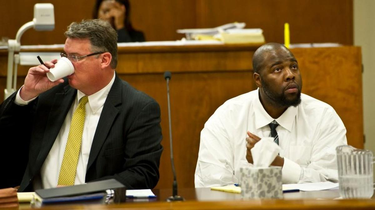 Nathan Taylor, right, and his attorney wait for the jury pool to enter the courtroom during his trial in March.