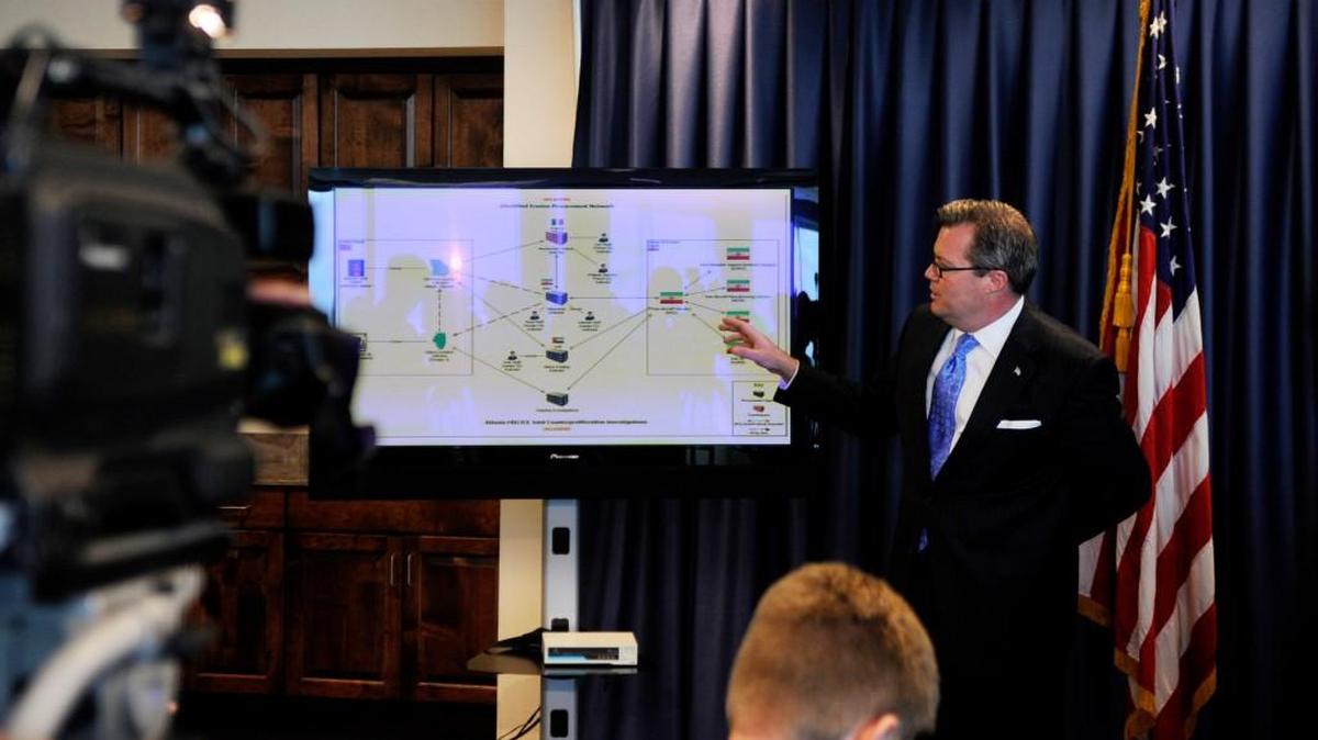 Then-U.S. Attorney Michael Moore talks during a June 2011 news conference, explaining an alleged arms sales network providing aircraft parts to Iran,