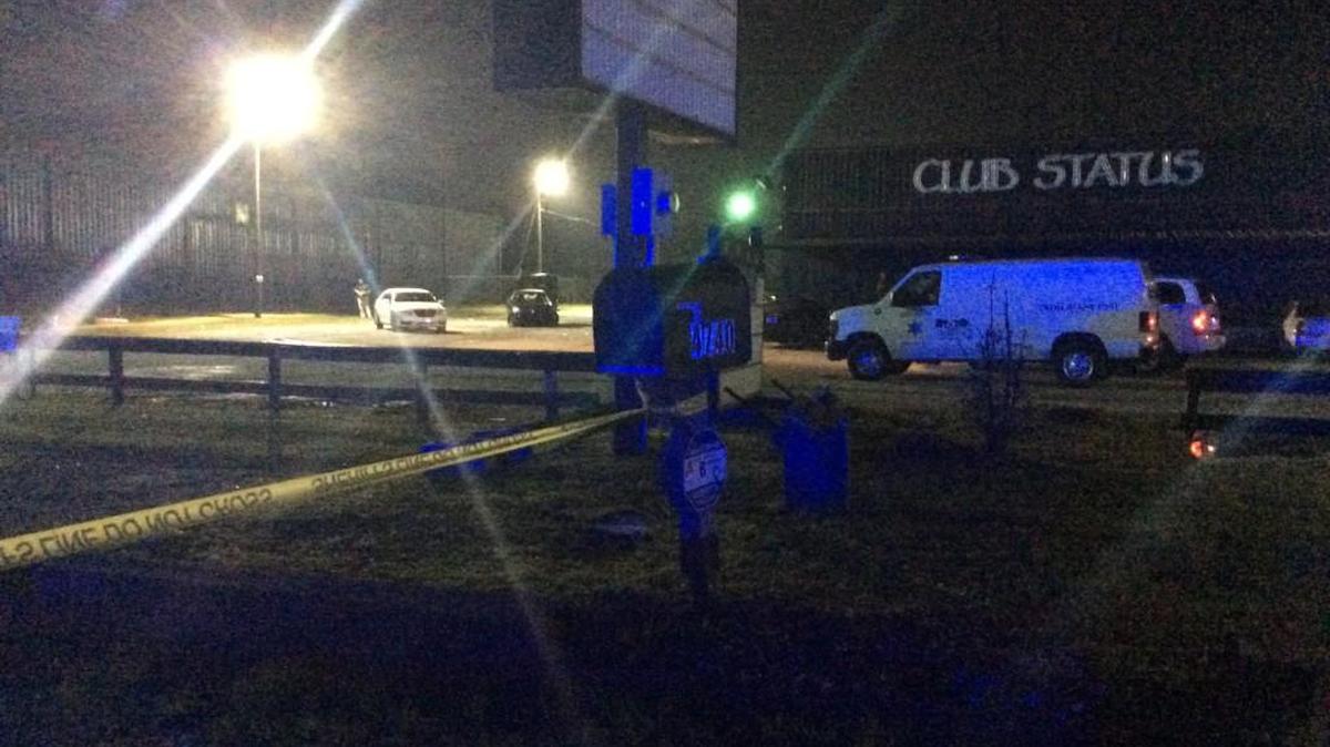 Bibb County sheriff’s crime lab technicians look for evidence following a shooting after a fight at Club Status early Wednesday at 4740 Pio Nono Ave.