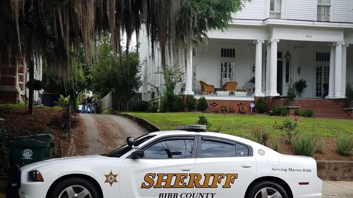 A police investigator is behind a house at 953 High St. Tuesday morning.