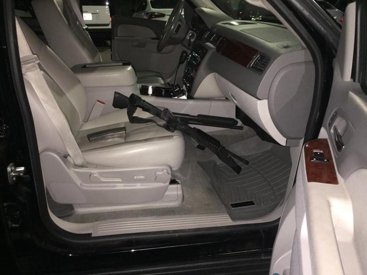 Guns at the ready inside Putnam County Sheriff Howard Sills’ Chevy Suburban in the moments before he and other lawmen brought a pair of accused-killer escapees back to Georgia from Tennesssee.