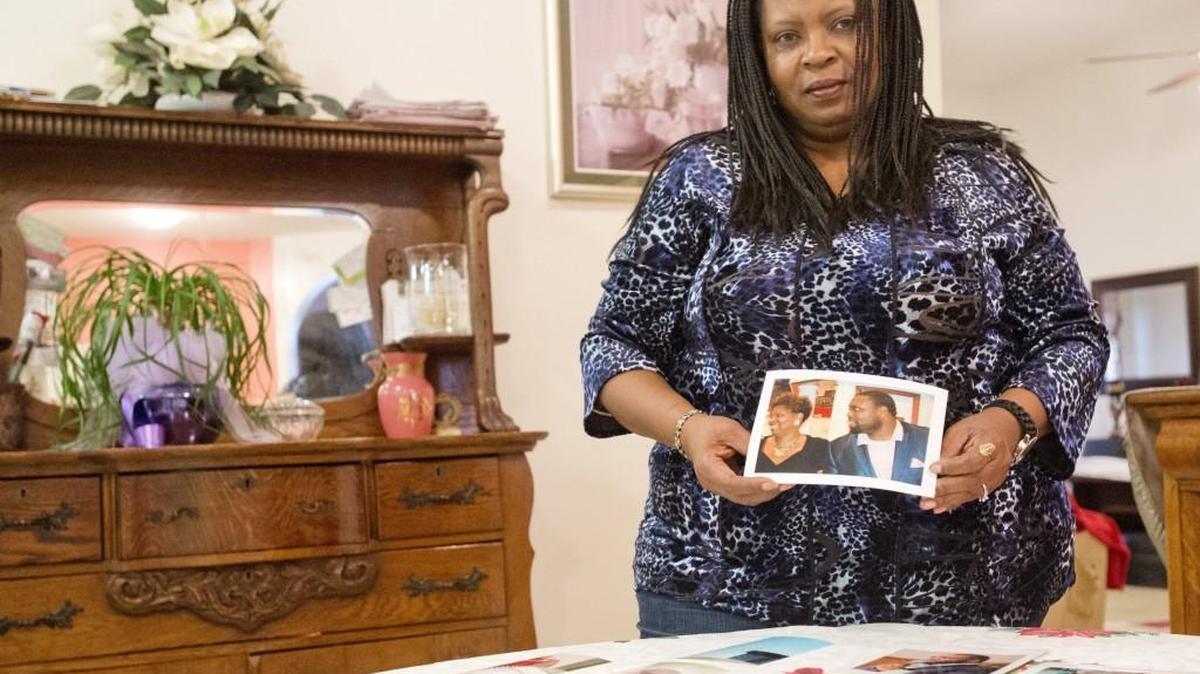 Belinda Parker holds a photo of her son, Brandon Parker. Prosecutors decided not to pursue charges against Tracia Hubbard in Parker's April fatal shooting.