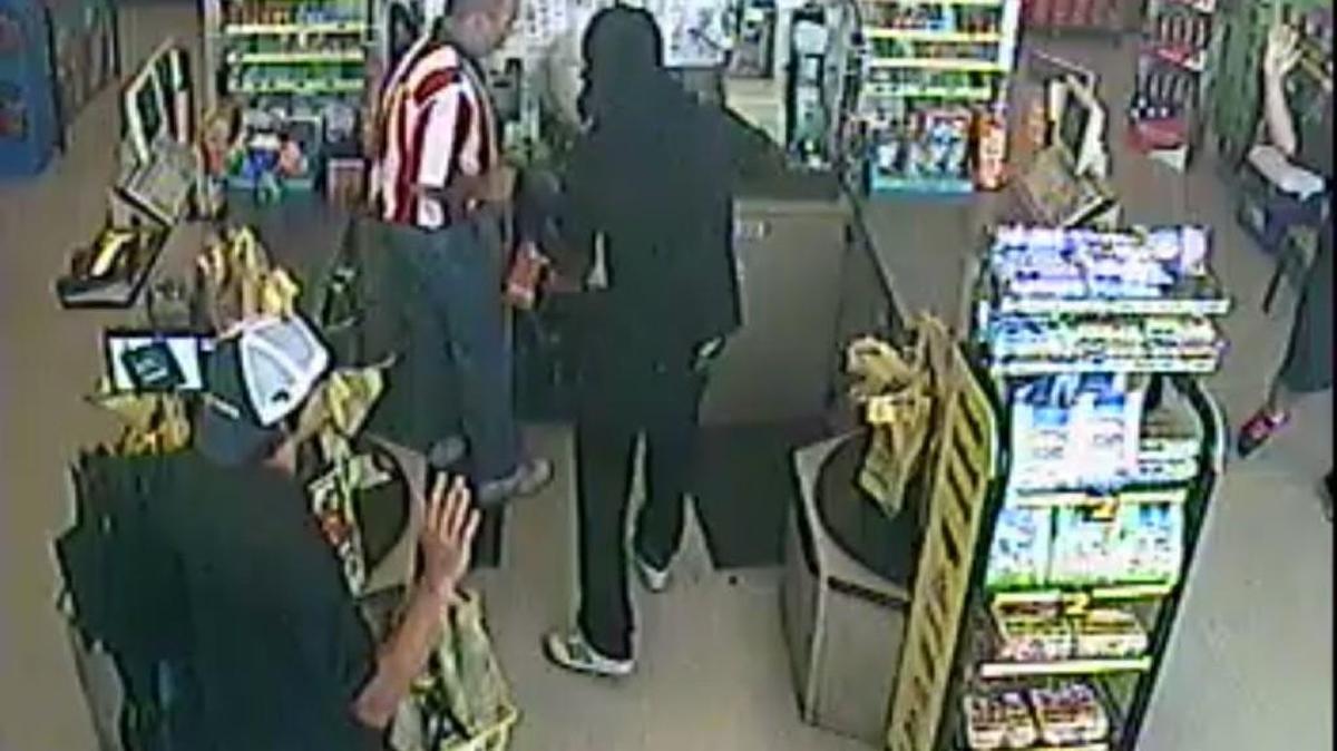 Surveillance video shows a bandit during a stickup at Dollar General in south Macon. The suspect fled toward Rutland Place Apartments.