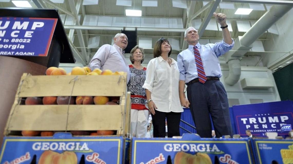 Former Gov.Sonny Perdue, left, and his wife, Mary introduce Republican vice presidential candidate Mike Pence and his wife at a rally in Perry during the campaign in August.