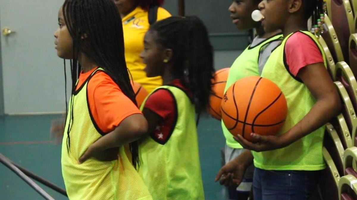 Girls get ready to take their turn on the court at Vineville Methodist Church summer basketball camp.