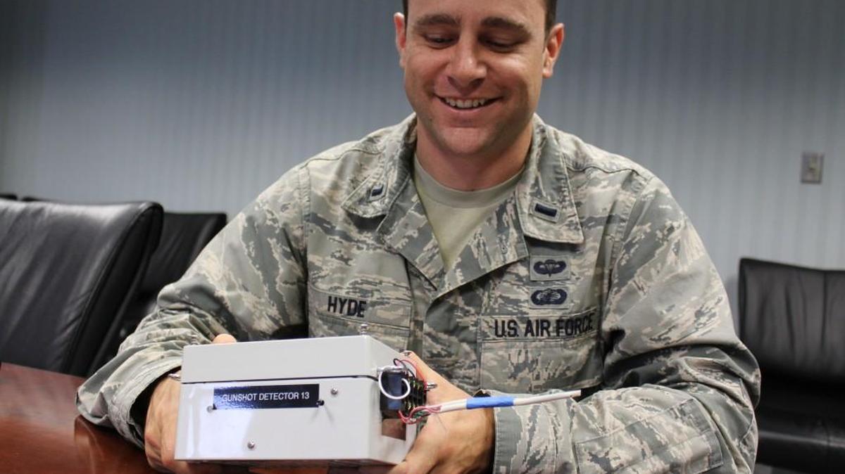 1st Lt. Andrew Hyde, an F-15 engineer at Robins Air Force Base, shows a prototype of a gunshot detector that he and five other engineers developed to prevent deaths in an active-shooter situation.