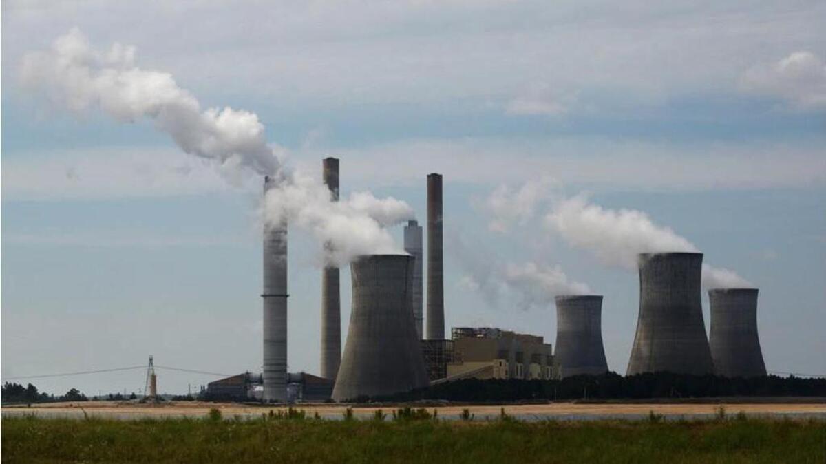 Plant Scherer, pictured in this 2014 file photo, needs a water pollution permit review, say plaintiffs in a new lawsuit.