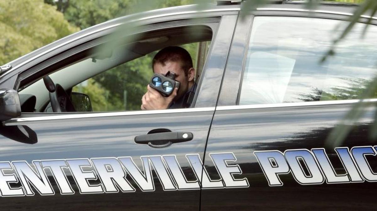 Centerville police Sgt. Paul Hollar uses an infrared laser gun to check for speed violations along Sentry Oaks Drive in this Telegraph file photo.