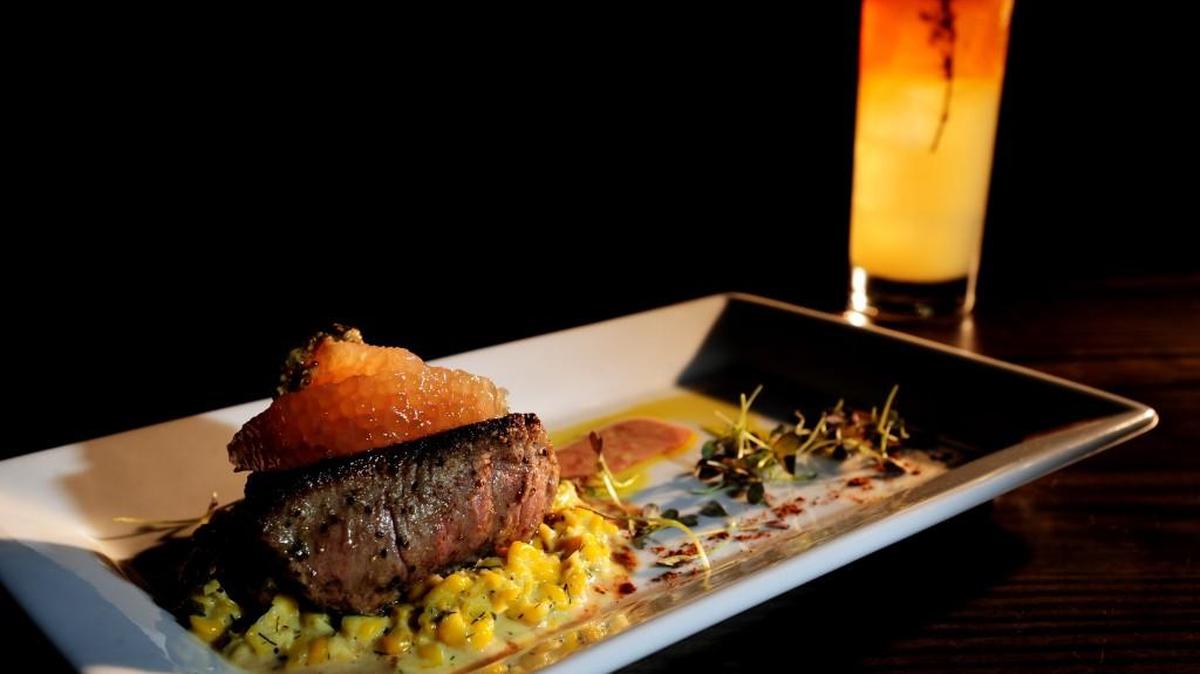 The veal tenderloin with dill cream corn, grapefruit, whole grain and micro mustards from Dovetail in Macon.
