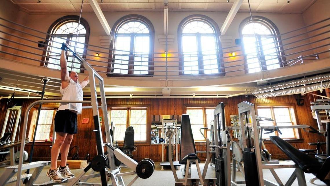 Andrew Foster uses weight training machines July 21, 2010, at The Macon Health Club downtown.
