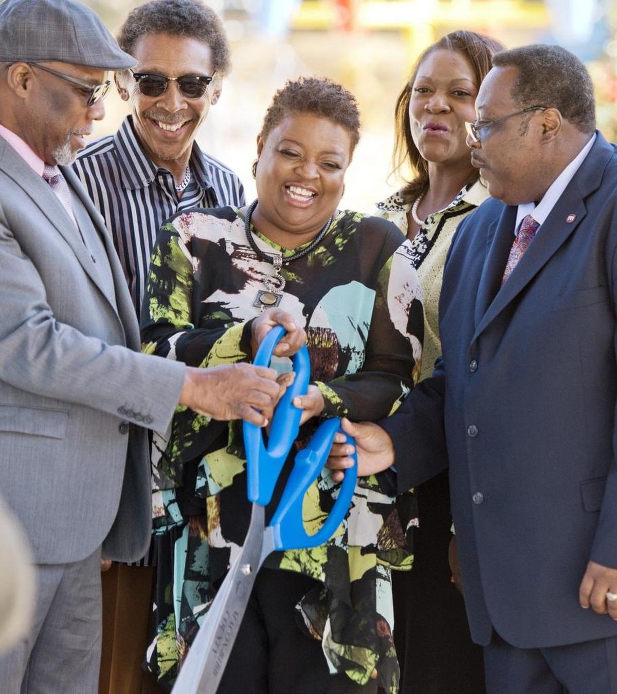 Alfreda Lockett, center, daughter of Filmore Thomas cracks a smile after cutting the ribbon during a ceremony to dedicate Filmore Thomas Park in this 2016 Telegraph file photo.