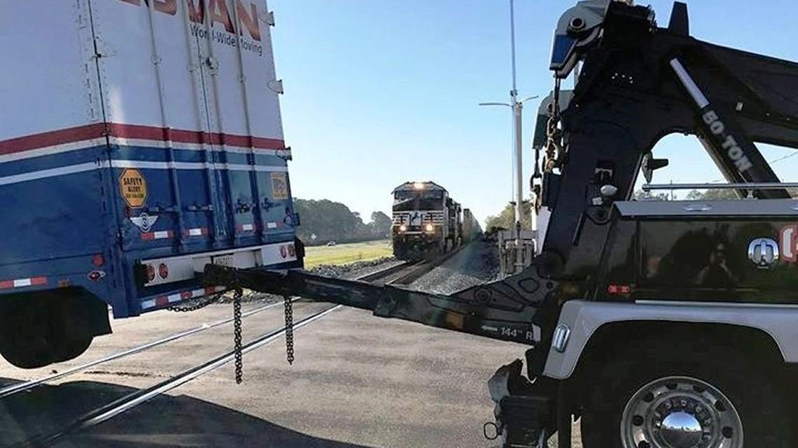 A near collision between a train and a tractor-trailer was avoided Thursday morning at Green Street and Ga. 247.