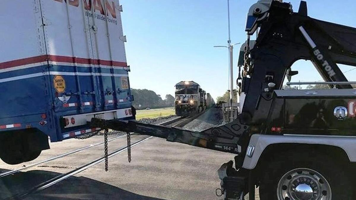 A near collision between a train and a tractor-trailer was avoided Thursday morning at Green Street and Ga. 247.