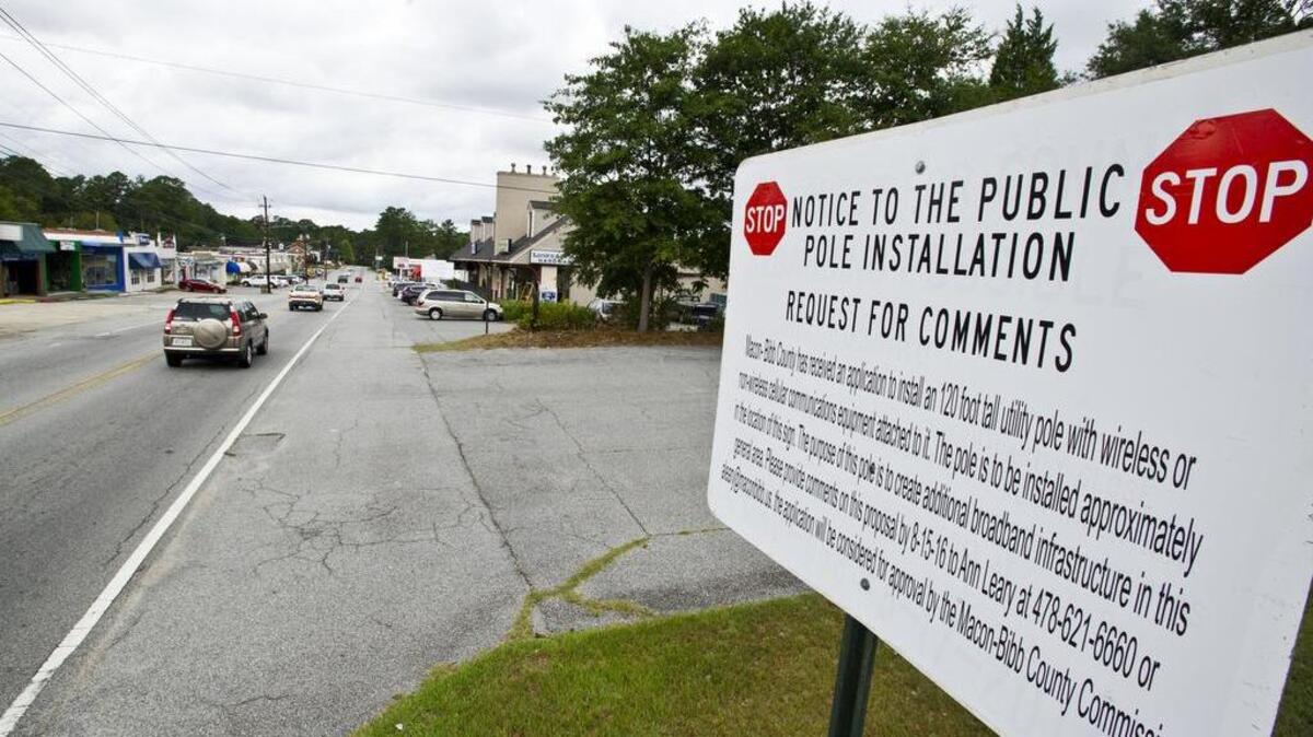 A sign on Ingleside Avenue near Rogers Avenue is alerting residents and businesses to the possibility of a 120-foot tall utility pole in the area in August 2016.