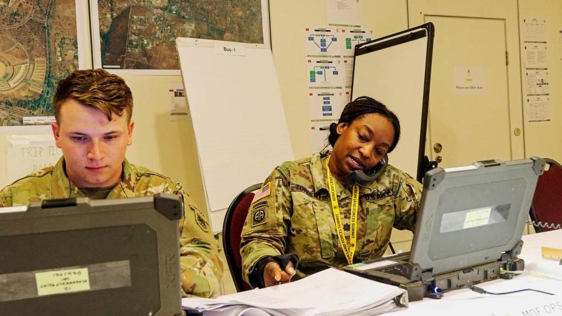 Lt. Col. Akemi Torbert, a U.S. Army Africa communications planner, talks on the phone while planning for the African Land Forces Summit in Malawi.