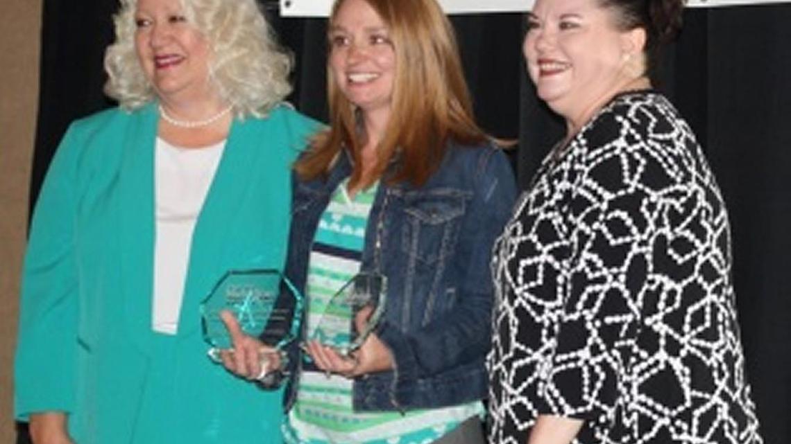 Houston County School Nutrition Director Meredith Potter, center, accepts awards at a banquet in October.