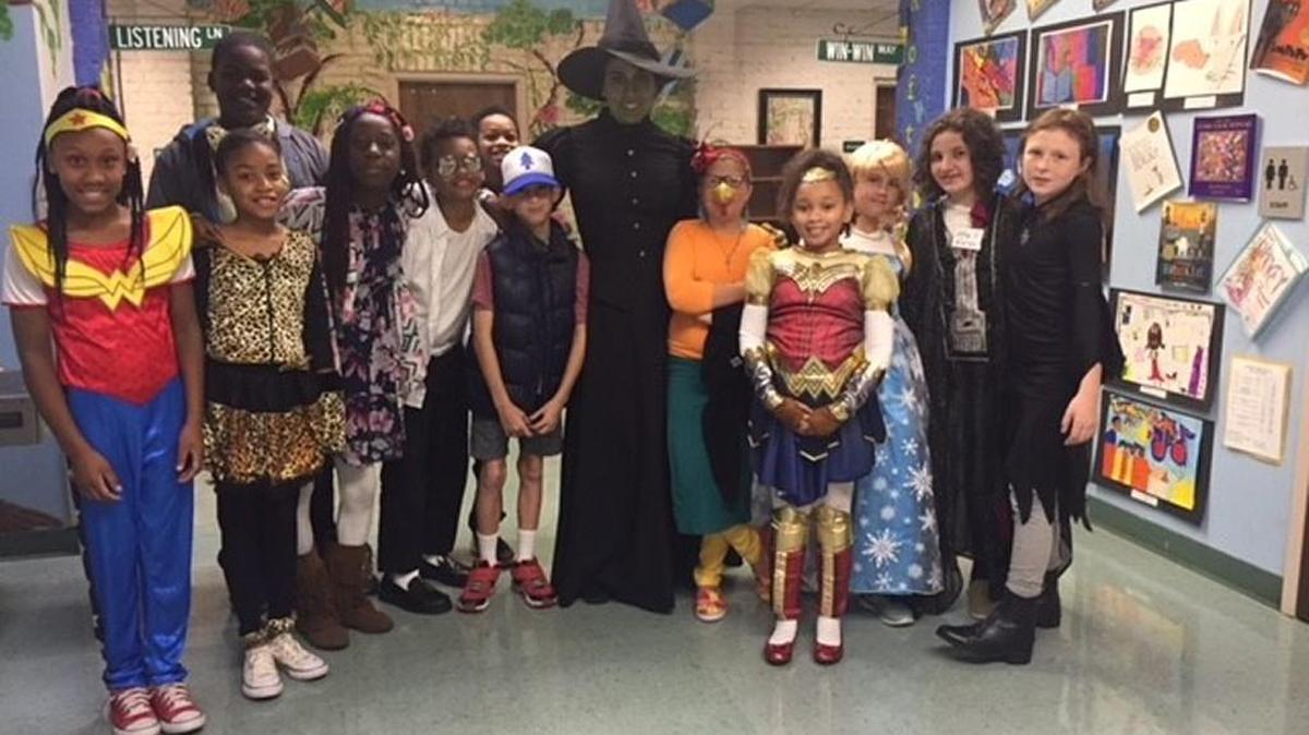Danielle Bocchino, from Vineville Academy, dressed up as the green-skinned character Elphaba from the Broadway musical “Wicked” on Halloween to deliver an anti-bullying message to students.