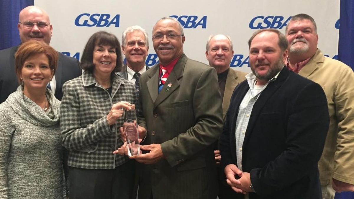 Pictured with the Exemplary School Board award, from left, front to back, are Houston County board members Lori Johnson, Helen Hughes, Fred Wilson and Bryan Upshaw; Superintendent Mark Scott; and Board members Rick Unruh, Dave Crockett and Hoke Morrow.