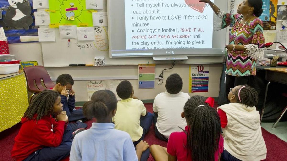 Vineville Academy 4th grade teacher Precious Jones talks with students in 2016 about testing strategies as they prepare for Georgia Milestone tests.