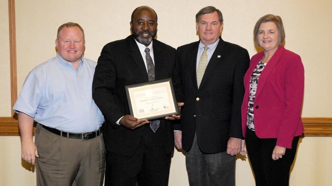 From left, Chip Lundy, Georgia Association of Secondary School Principals middle school at large representative; Thomson Middle Principal Walter Stephens; James Kahrs, executive director of the Principal’s Center at Georgia State University; and Wanda Law, the association vice president, are shown at the association’s fall conference.