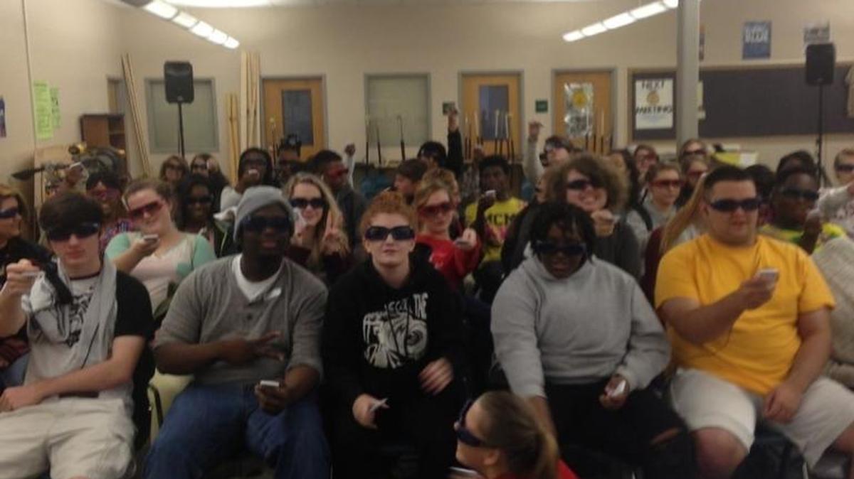 Rutland High School Family, Career and Community Leaders of America Club members use interactive remotes and 3D glasses for a question-and-answer session during the Cinema Drive program Dec. 2.