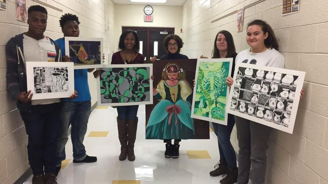 Perry High School students are pictured with their winning artwork. From left are Daniel Ross, Kyle Glover, Raelyn Mickels, Savannah Bixler, Taylor Owens and Callie Collins.