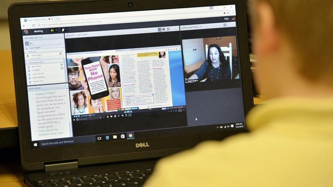 Weaver Middle School sixth-graders in Macon use their laptops to take an English class from a teacher in Texas via the internet on Dec. 2, 2016.