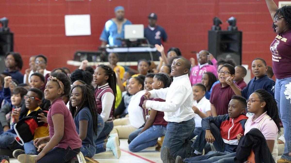 Lane Elementary School students cheer during a pep rally to prepare for the Milestones test. A retired PE teacher got into the act as a disc jockey. Robert Woods, also known as “D.J. Hollywood,” said he loved helping out and getting the kids what they needed before the big test.