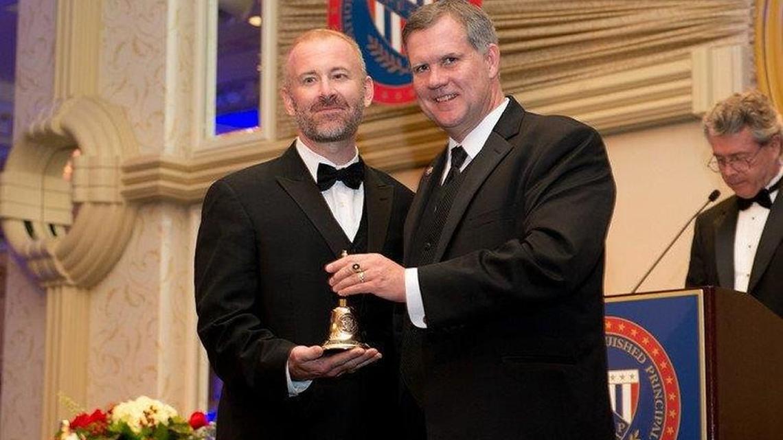 Dr. Jesse Davis, principal of Feagin Middle School, left, is pictured with Georgia Association of Middle Schools Principals Executive Director Dr. Bob Hearberlin.