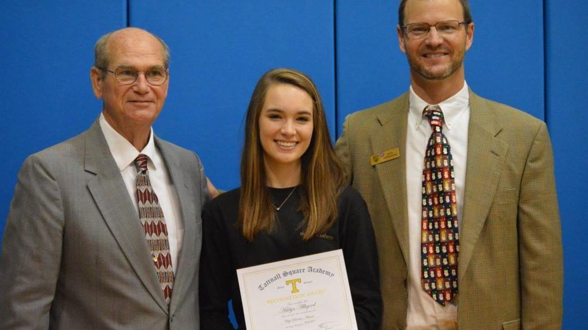 Pictured are Ashlyn Alligood, this year’s Chip Davidson Scholarship Award winner; Chip Davidson, former school coach; and Tattnall Square Academy Head of School John Hankinson.