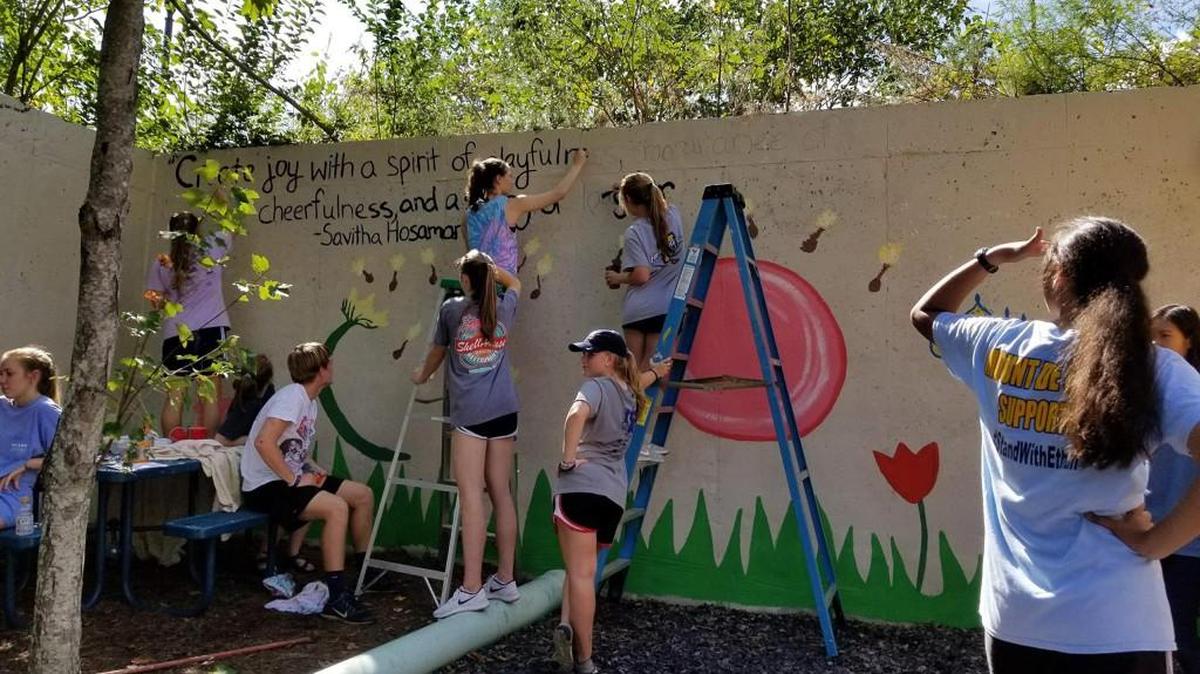 Mount de Sales Academy students create a mural for the Ronald McDonald House during Senior Service Day on Oct. 11.