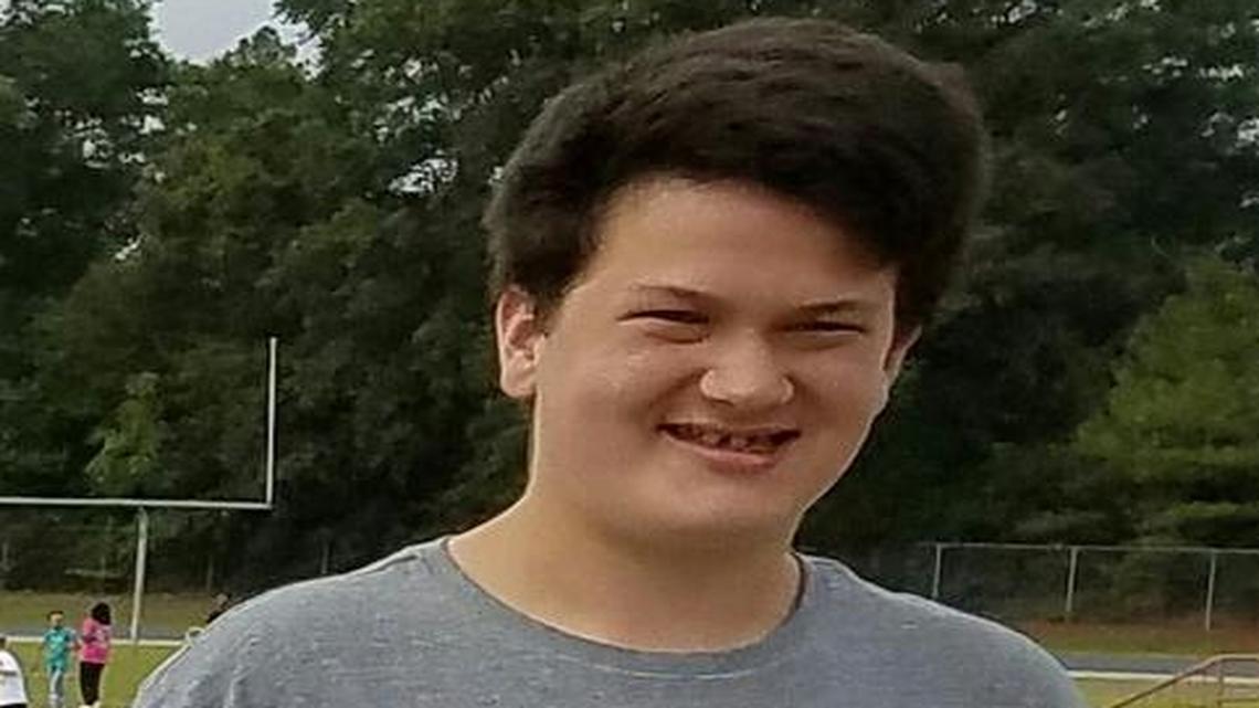 Carl King, eighth-grader at Perry Middle School, is shown with his winning poster.