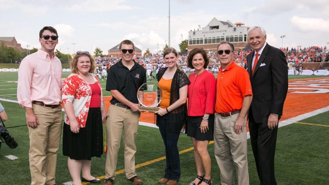 Mercer received a trophy for highest student voter participation in “SoCon Votes,” the first NCAA Division I conference championship for voter participation, during halftime of the homecoming football game in November. Pictured are Joseph Wozniak, Mercer University 2016 Mercer graduate and creator of competition; Hannah Vann, Mercer staff adviser to student group Mobilize Mercer; Austin Paul, student representative from Mobilize Mercer student group; Emily Thompson, student representative from Mobilize Mercer student group; Lyne Murphy, from tournament sponsor the Knight Foundation; Douglas Pearson, Mercer vice president and dean of students; and Mercer President Bill Underwood.
