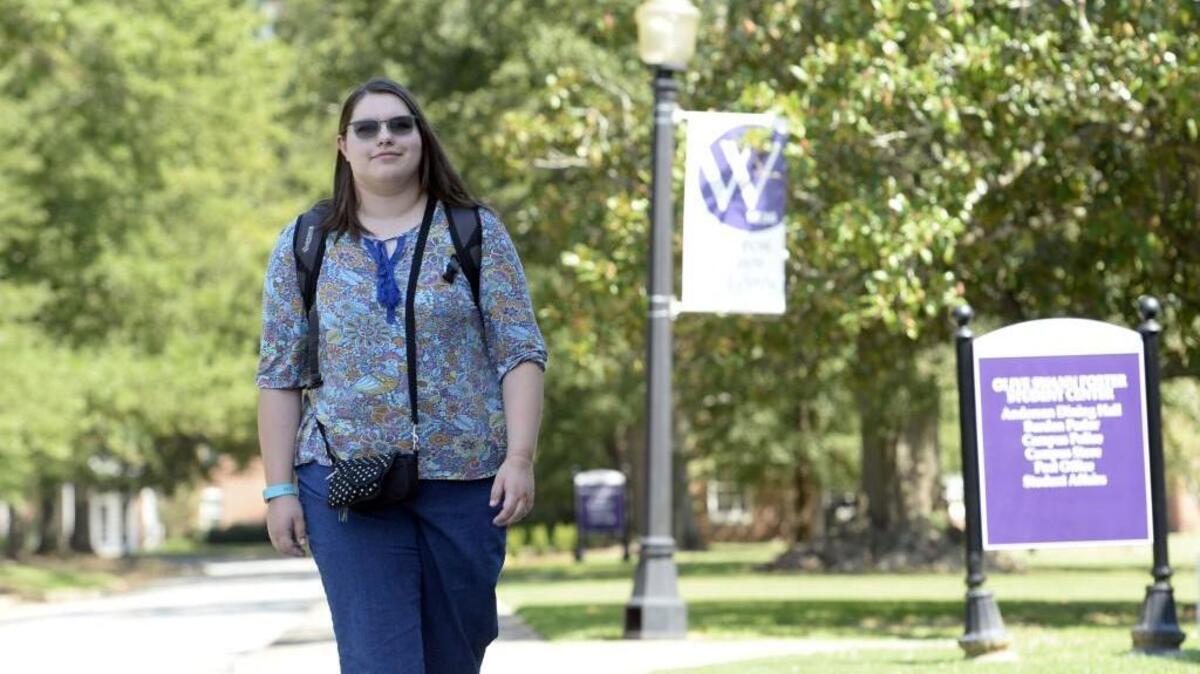 Brenda Wilkinson makes her way through the Wesleyan College campus, where she has been a student since she was dually enrolled as a senior in high school last year.