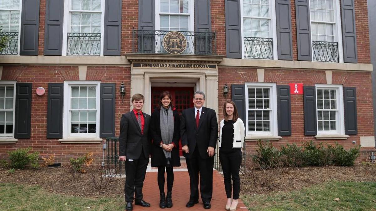 From left, Tristan Bagala, Ishana Ratan, University of Georgia President Jere Morehead and Eleanor Traynham stand in front of UGA’s Delta Hall in Washington, D.C.