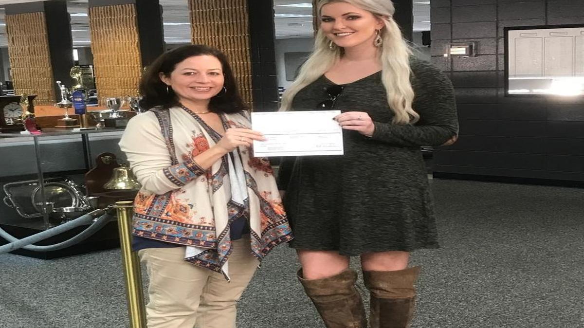 Kathleen Medlin, left, Stratford Academy’s director of institutional advancement on the left, is pictured with 2010 alumna Allison Walthall, representing Walthall Oil Company. Stratford Academy received two $500 grants from the Exxon Mobile Educational Alliance grants.