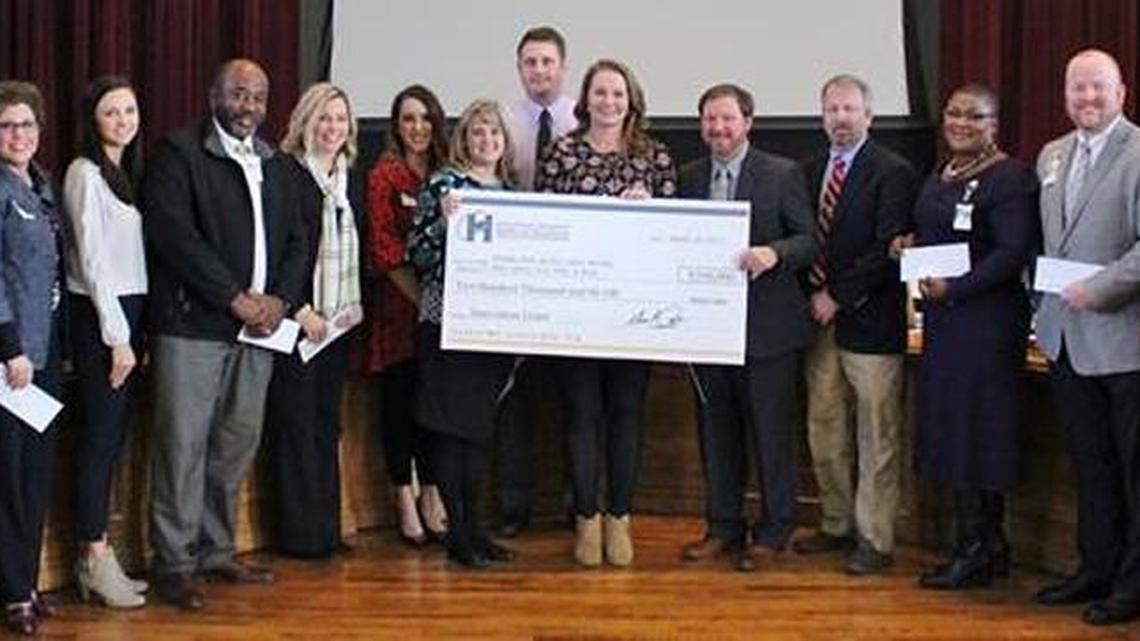 Pictured with their grant awards during the Jan. 10 Houston County Board of Education meeting are: Board Chairman Fred Wilson; Cindy West, of Westside Elementary; Kim Halstead and Kayla O’Brien, Tucker Elementary; Walter Stephens, Thomson Middle; Michelle Davis and Dana Wiggins, Quail Run Elementary; Jennifer Ham and Jake Harvey, Mossy Creek Middle; Marla Garnto, Northside Elementary; William Wilson, Langston Road Elementary; Will Ray, Kings Chapel Elementary; Gwendolyn Taylor, Huntington Middle; JoeyHinson and Tomieka Waller, Feagin Mill Middle; and Houston County Superintendent Mark Scott.