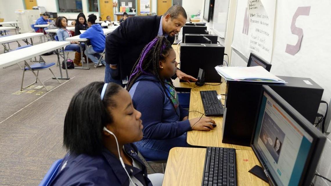 Miller Middle School Saturday school teacher Jermel Miller helps students in the computer lab practice Milestones testing as they get ready for the big spring test.