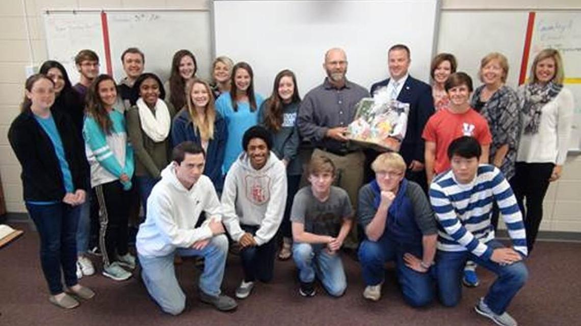 Veterans High School teacher Dave Gibbs, center back, is pictured with his co-workers and students after being named Houston County Gifted Teacher of the Year.