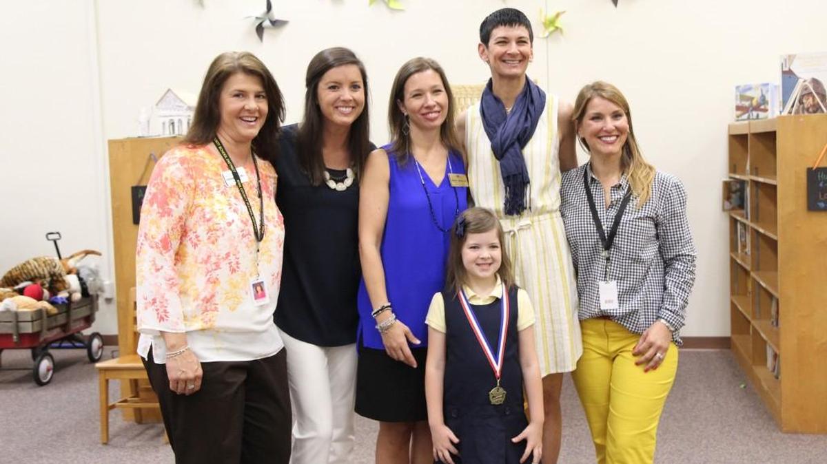 Springdale Elementary School kindergartner Merrill Long and her teachers celebrate her Millionaire Club honor.
