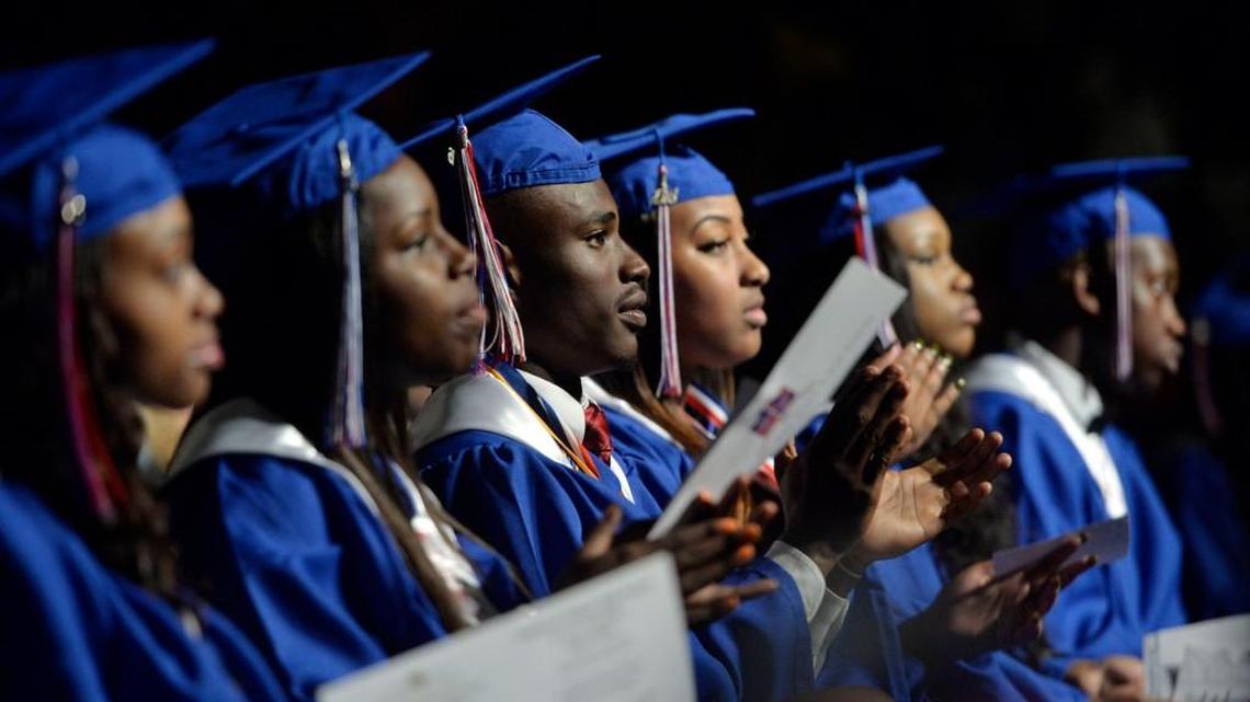 Southwest High School grads applaud their principal, Dexter Martin, at the Macon Coliseum during graduation exercises May 28, 2016. The composite scores of Bibb County students increased from 2018 to 2019, but are still behind the state and national averages.
