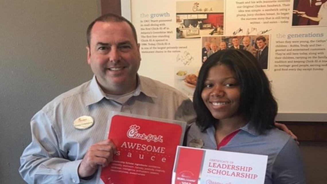 Craig Craddock, owner of the Chick-fil-A on Eisenhower Parkway, is pictured with employee and Chick-fil-A scholarship winner Christina Swann.