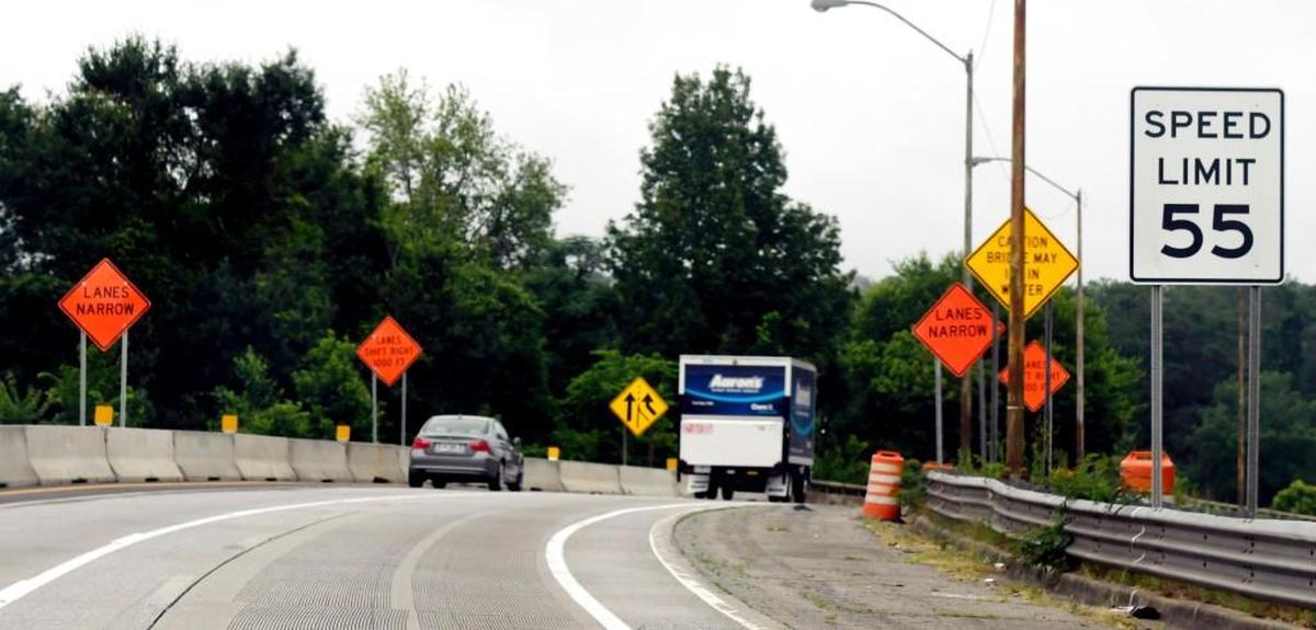 A 55 MPH sign and construction signs line the exit ramp from Interstate 75 to Interstate 16.