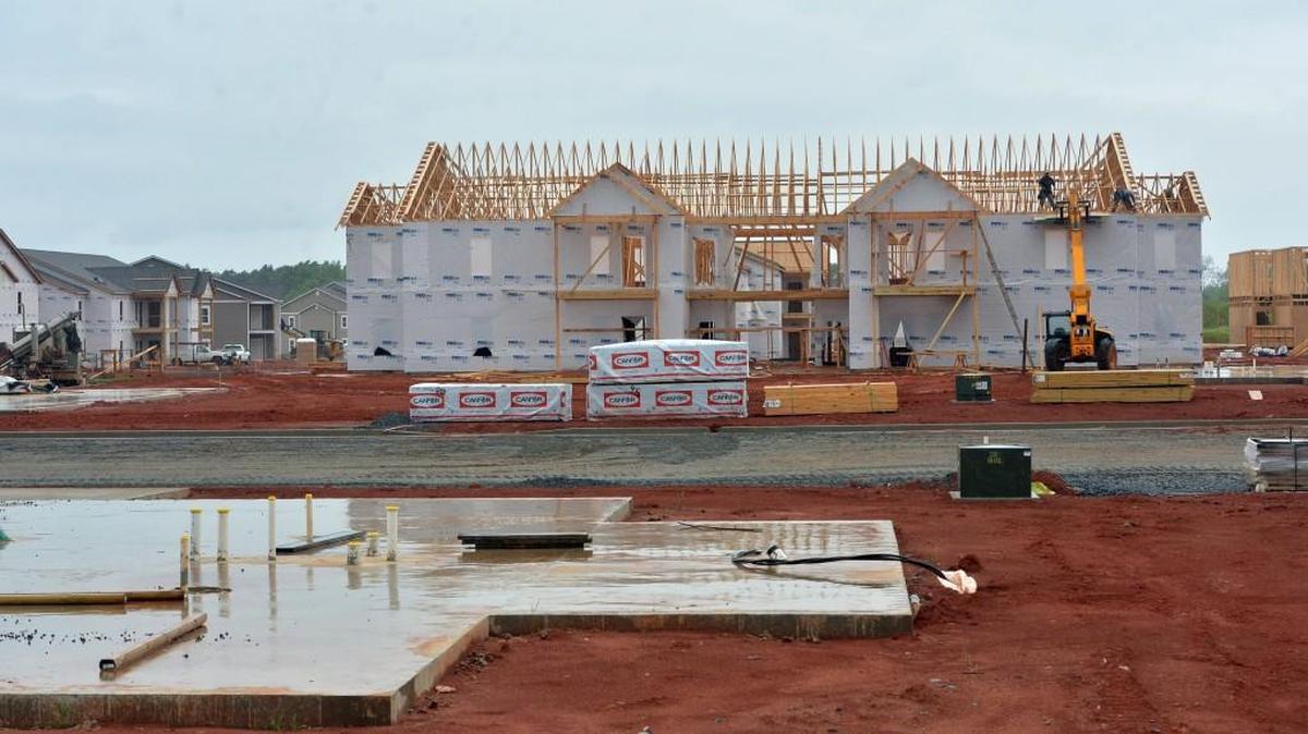 Framing carpenters and other tradesmen are busy constructing new apartments in Houston County off South Houston Lake Road between Cohen Walker Drive and Ga. 96.